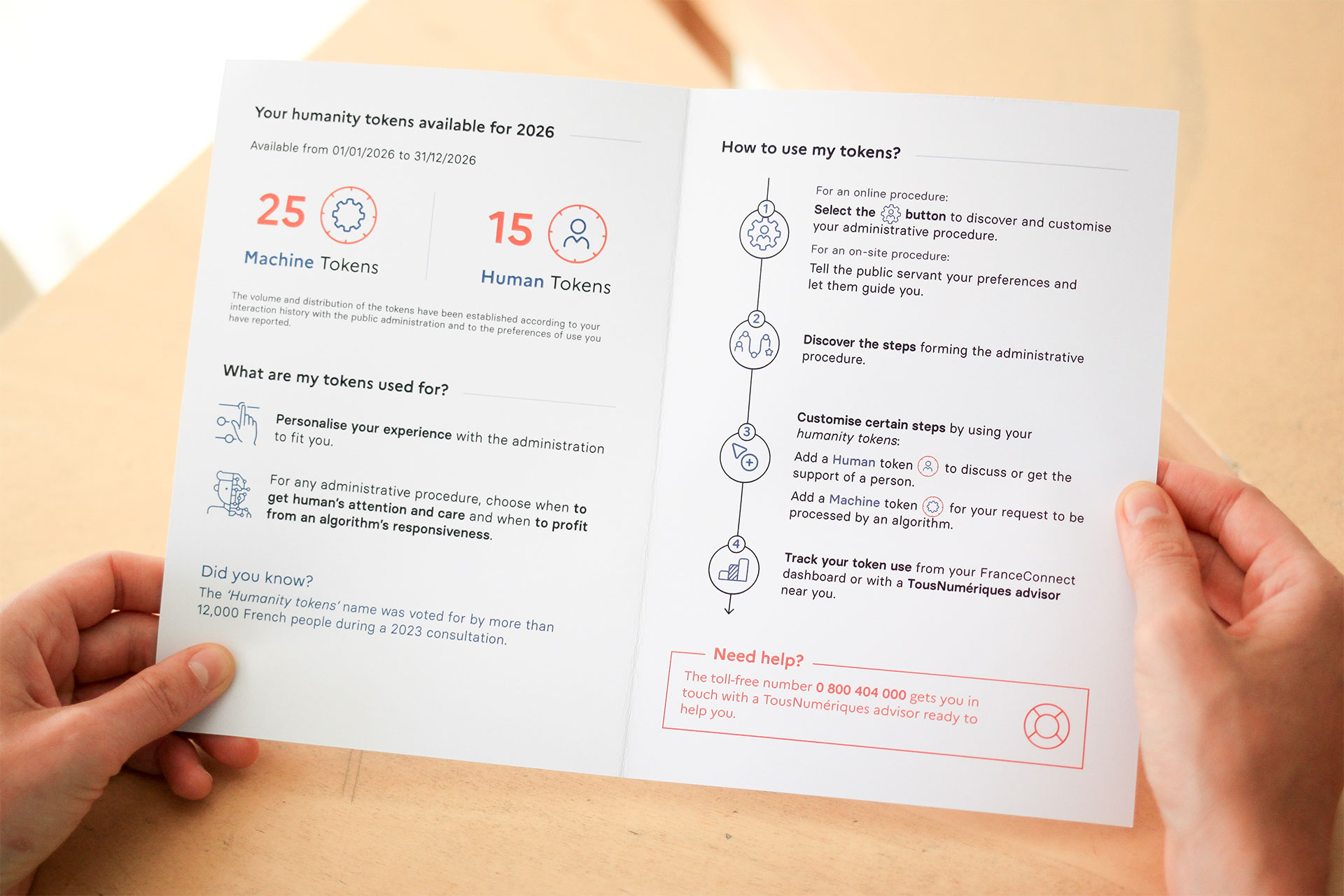 A woman holding the booklet of her annual Humanity Tokens statement